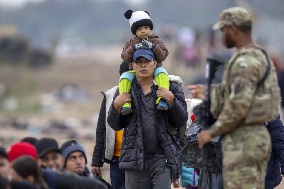 Justice Department threatens to sue Texas over anti-migrant "Show Me Your Papers" law