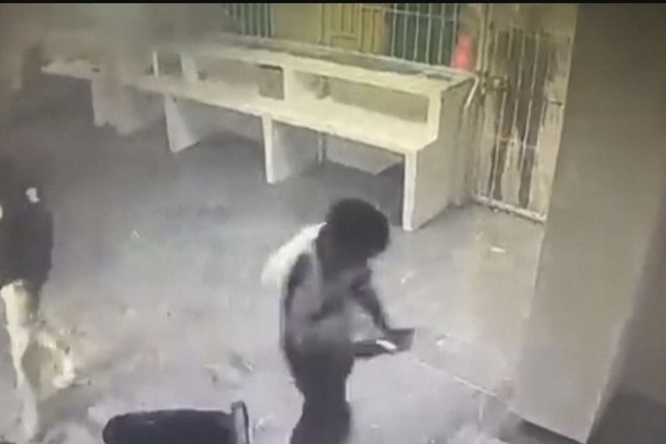 Guards caught fleeing Mexican detention center amid a fatal fire in alarming footage
