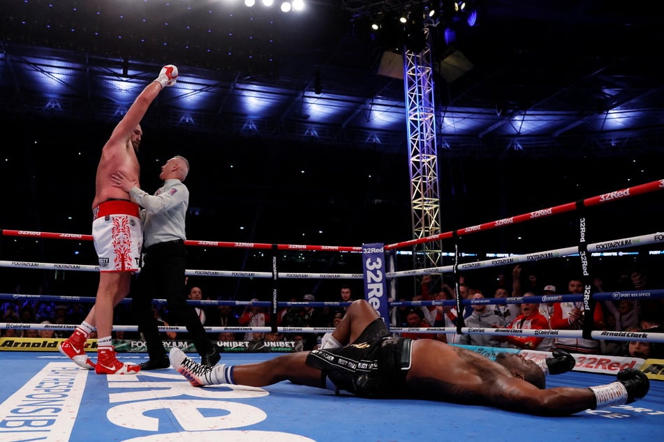 Dillian Whyte is left sprawling after a devastating uppercut by Tyson Fury.