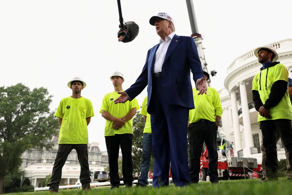 President Donald Trump unveiled the installation of two new large flag poles at the White House on Wednesday morning.