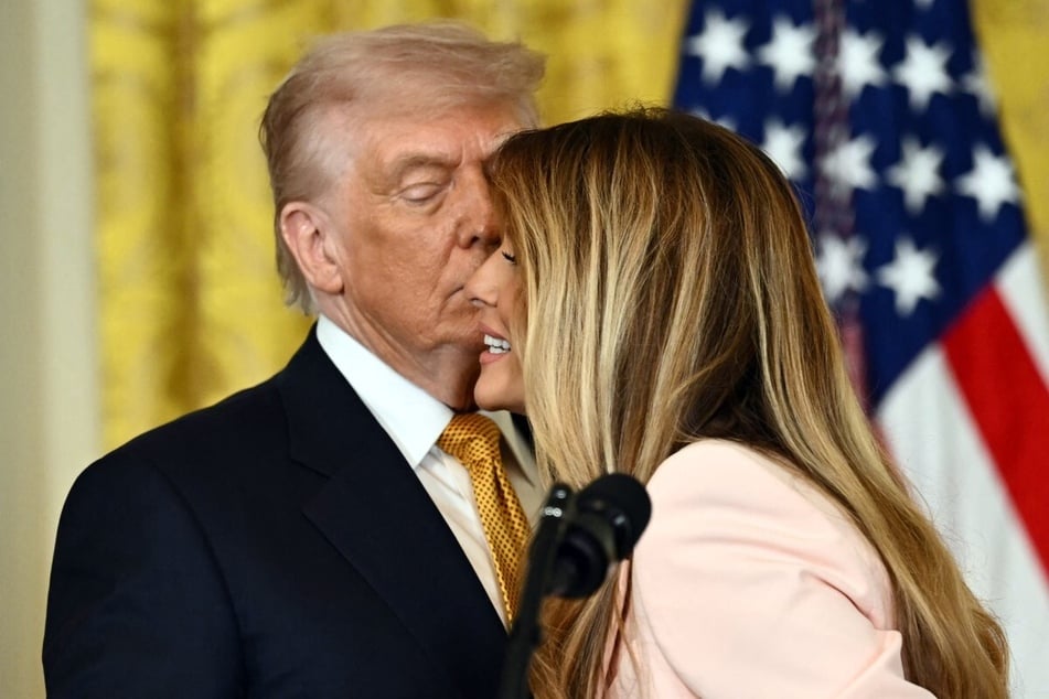 President Donald Trump (l.) and First Lady Melania Trump participate in a Military Mother's Day Event in the East Room of the White House in Washington, DC, on May 6, 2026.