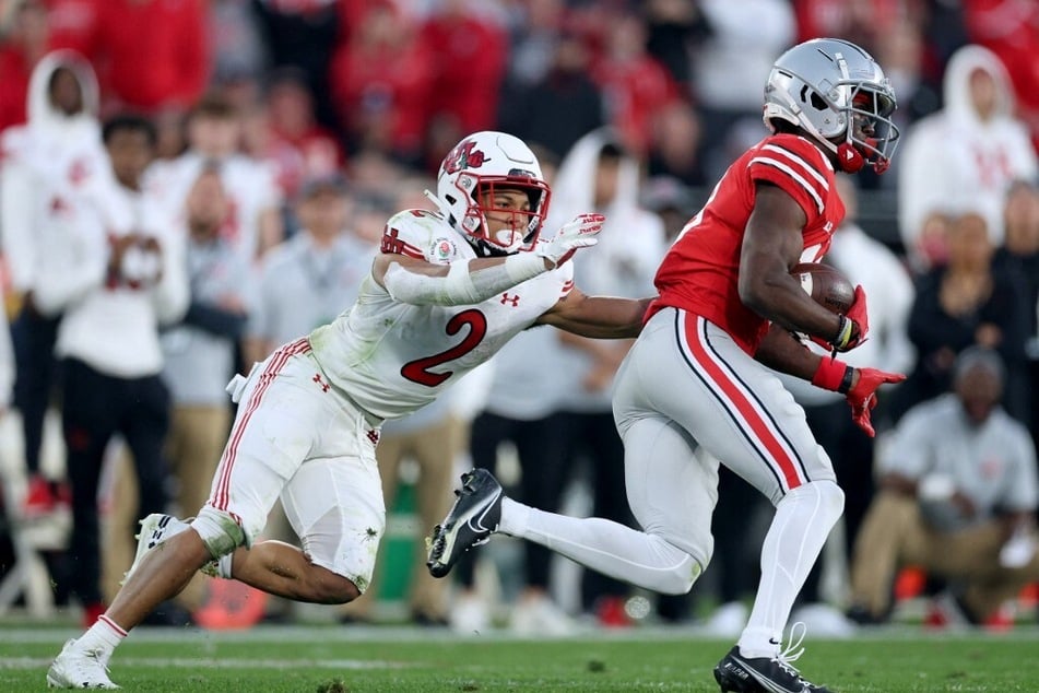 Marvin Harrison Jr. of the Ohio State Buckeyes runs after making a catch.