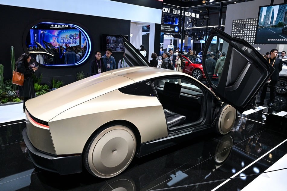 A Tesla Cybercab car is seen at the Tesla stand during the 8th International Import Expo (CIIE) in Shanghai on November 6, 2025