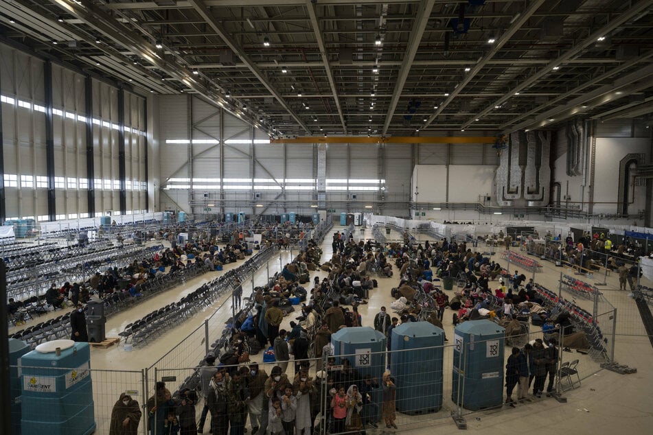 Afghan evacuees wait for transport to US at German air base