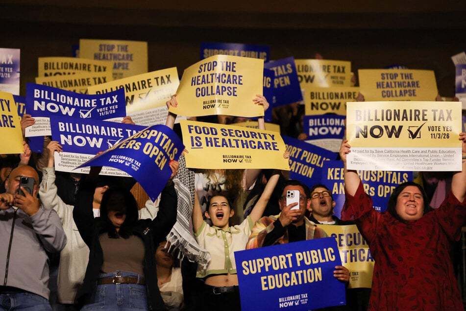 Attendees cheer during a rally in Los Angeles with Senator Bernie Sanders in support of the California Billionaire Tax Act on February 18, 2026.