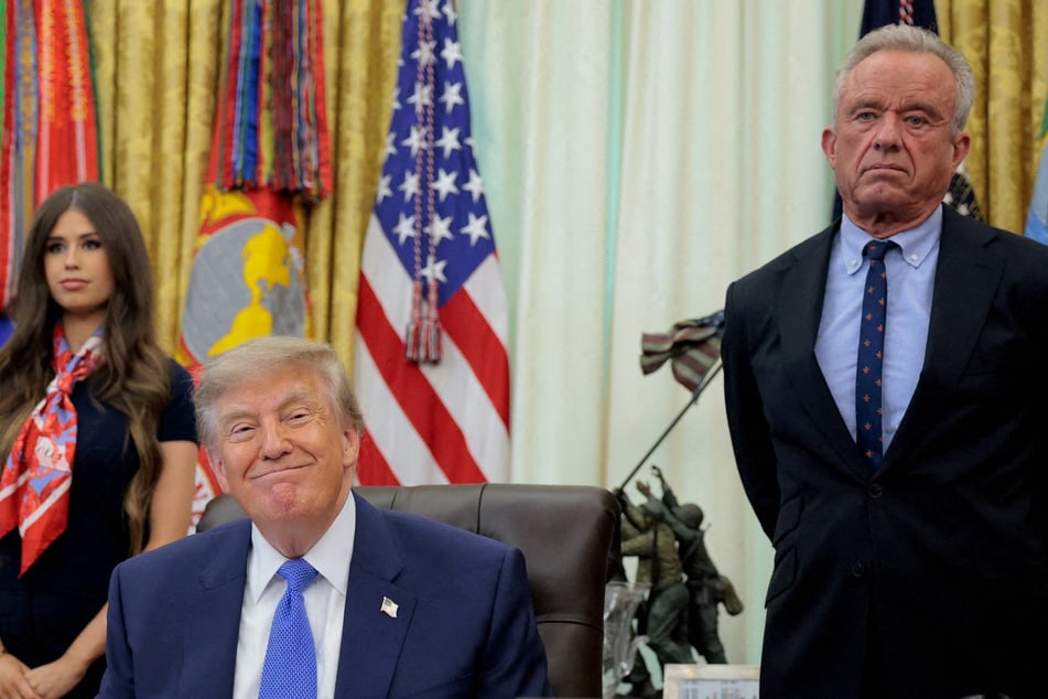 President Donald Trump (l) and Health Secretary Robert F. Kennedy Jr. have signed a new executive order pushing for changes to the childhood vaccine schedule.