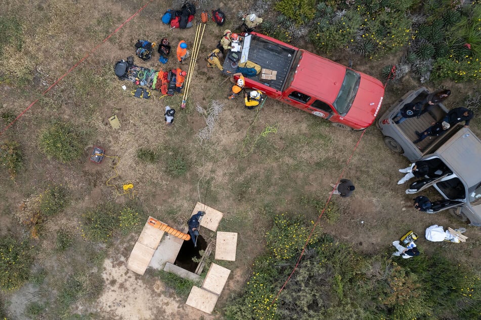 The three bodies were pulled out of a shaft near the edge of a Pacific Ocean cliff near the town of Santo Thomas, Mexico.