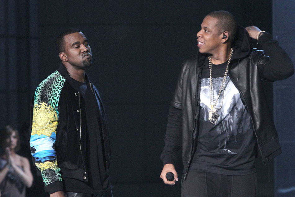 Kanye "Ye" West signed to Jay-Z's label, Roc-A-Fella Records, in 2002.