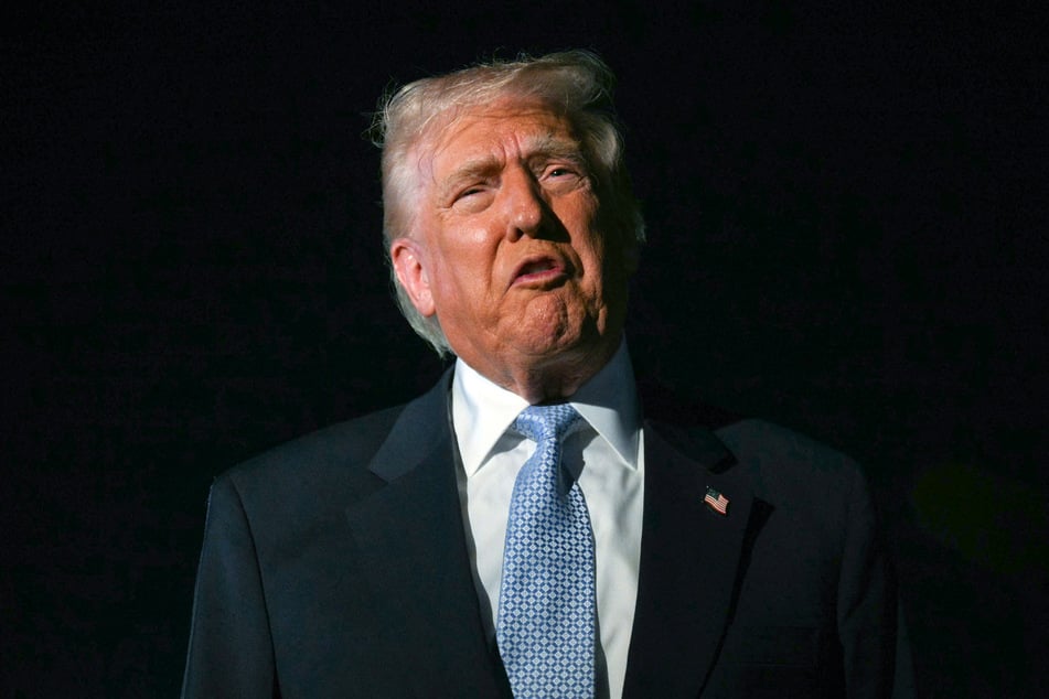 President Donald Trump speaks with reporters before boarding Air Force One as he departs Palm Beach International Airport in West Palm Beach, Florida, on November 16, 2025.