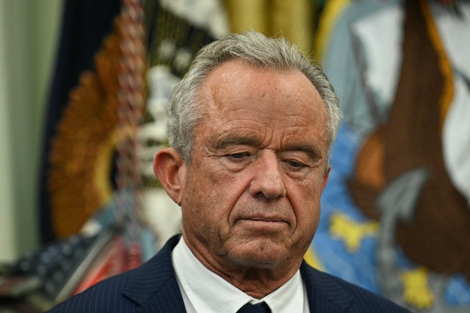 Health and Human Services Secretary Robert F. Kennedy Jr. listens on as President Donald Trump speaks about healthcare in the Oval Office. Pennsylvania authorities have just announced a fifth measles death.