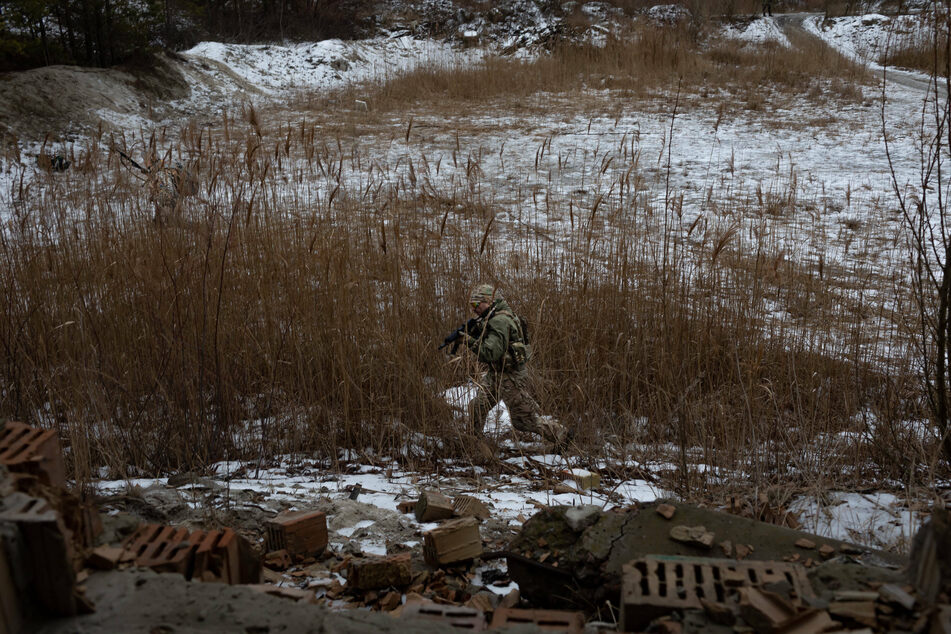 Ukrainian reservists and civilians take part in training with Territorial Defense Forces just outside the capital city of Kyiv.