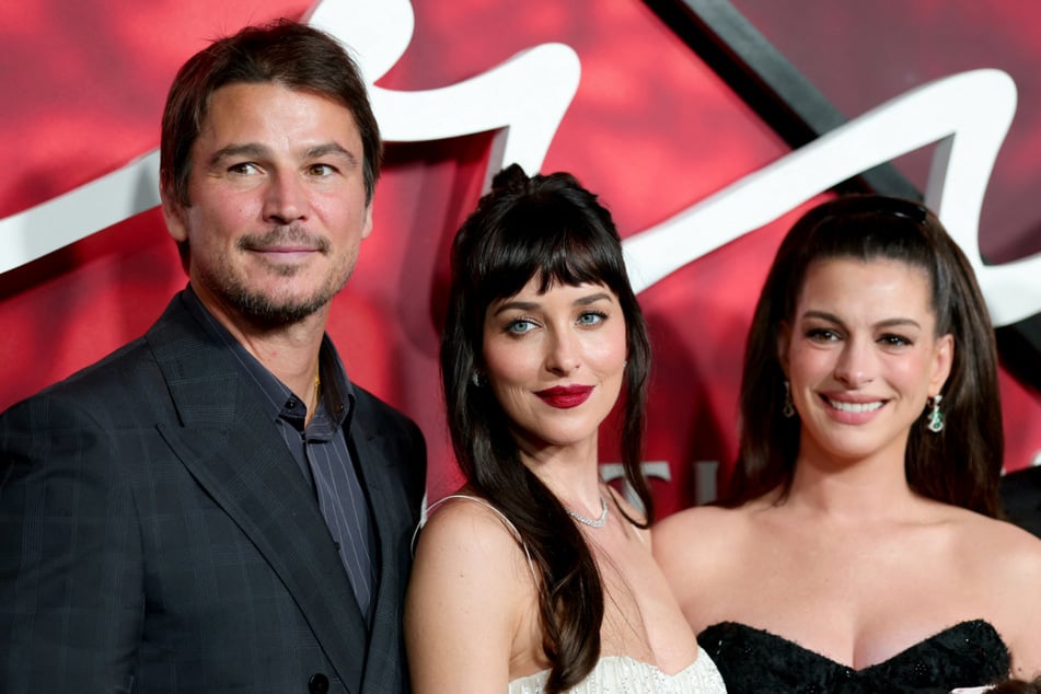 (From l. to r.) Josh Hartnett, Dakota Johnson, and Anne Hathaway attend the New York premiere of Verity. The movie is based on the bestselling book by Colleen Hoover.
