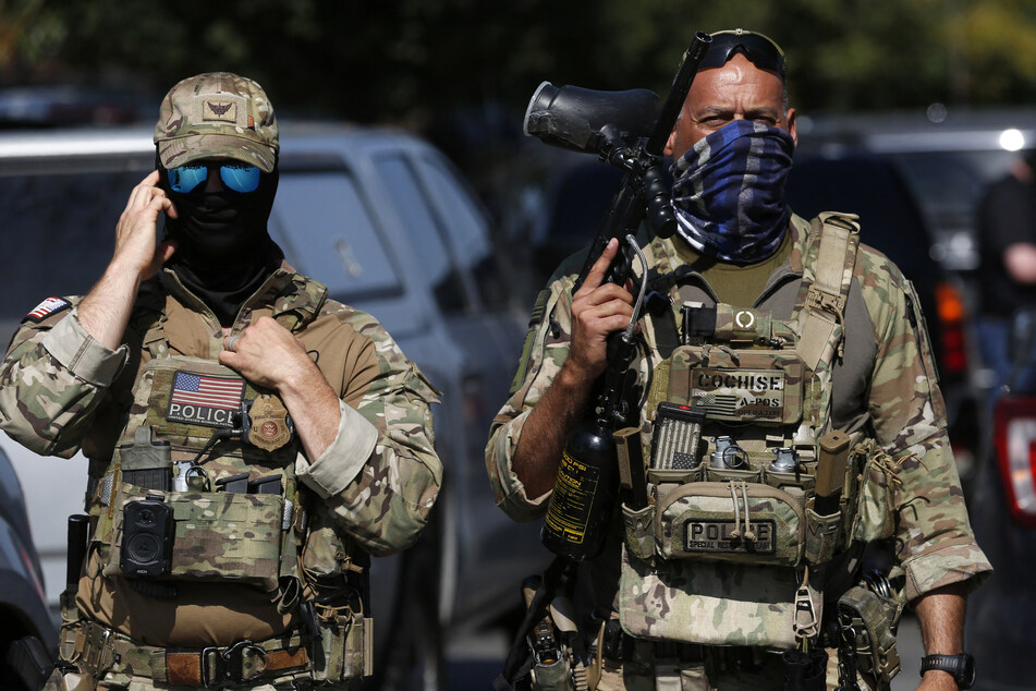 A US judge has blocked part of a California law that would have banned federal agents from covering their faces during operations.