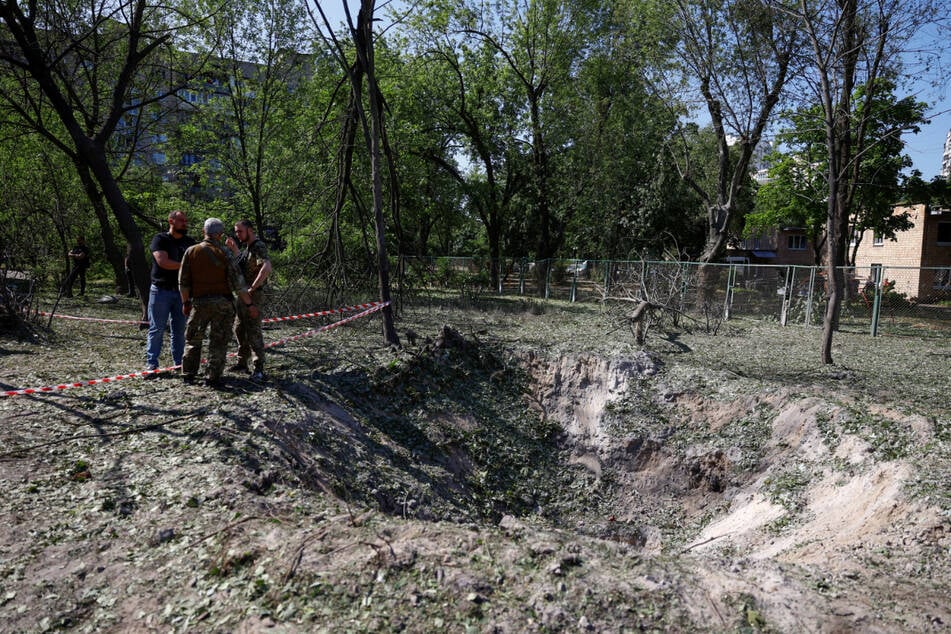 A Russian missile barrage on Kyiv early on Thursday killed at least three people, including two children.