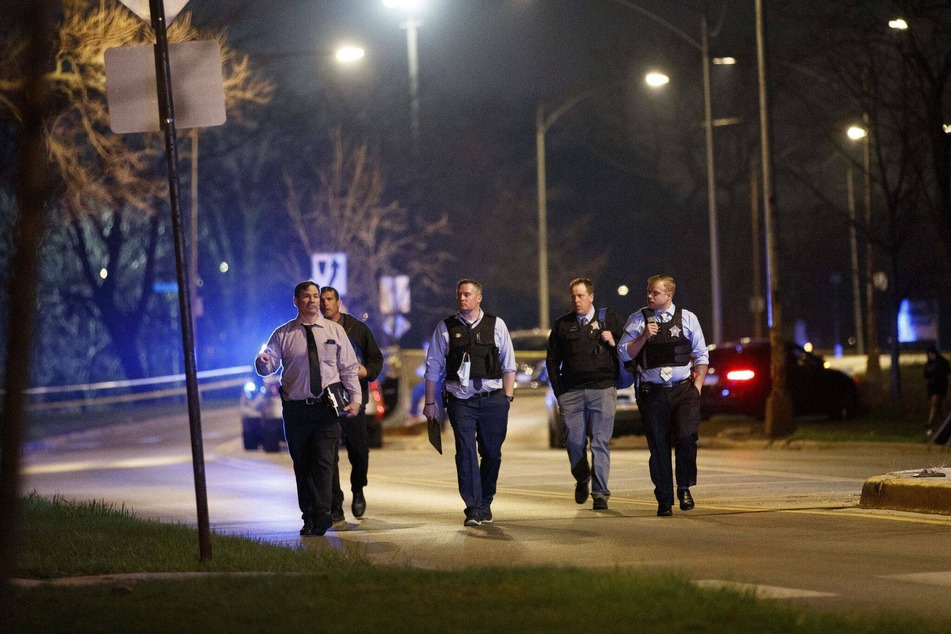 Chicago police investigate the scene where a 19-year-old and 20-year-old were shot on Easter Sunday.