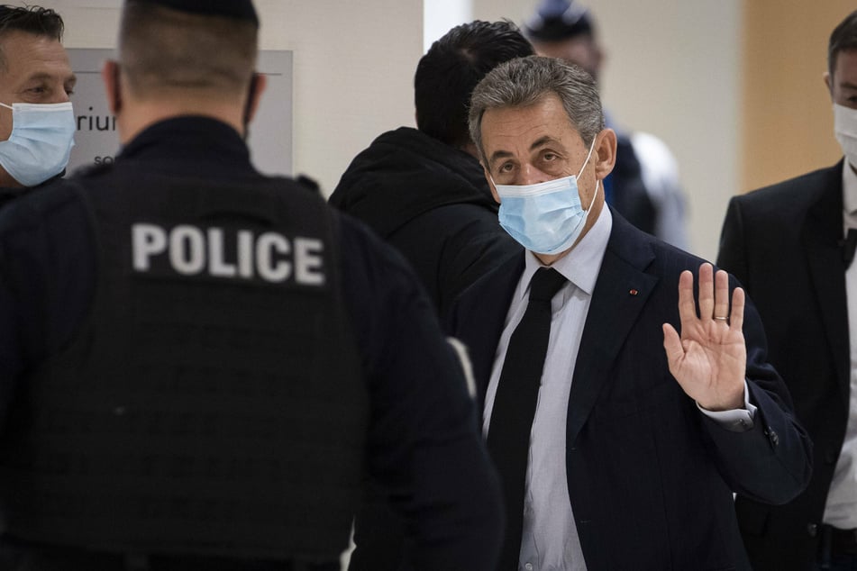 Former French president Sarkozy sentenced to three years in prison for bribery