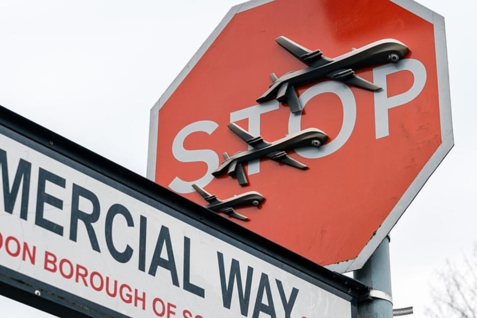 An artwork by Banksy was removed shortly after the artist confirmed its authenticity on Friday.
