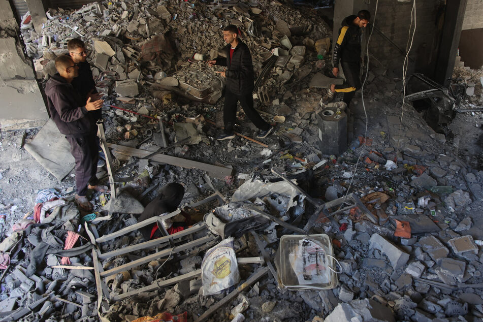 Palestinians inspect the damage to the home of the Tabatibi family after Israeli bombardment in the Daraj Neighbourhood of Gaza on April 12.