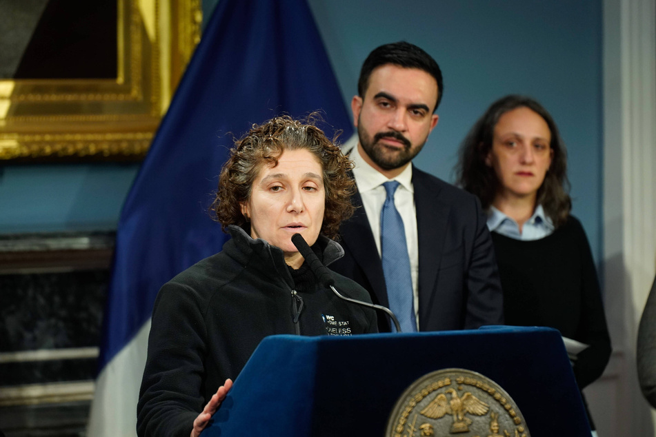 New York Mayor Zohran Mamdani (c.) looks on as Department of Social Services Commissioner Molly Wasow Park (l.) answers questions on the effects of the winter storm on the the city's unhoused residents on January 27, 2026.
