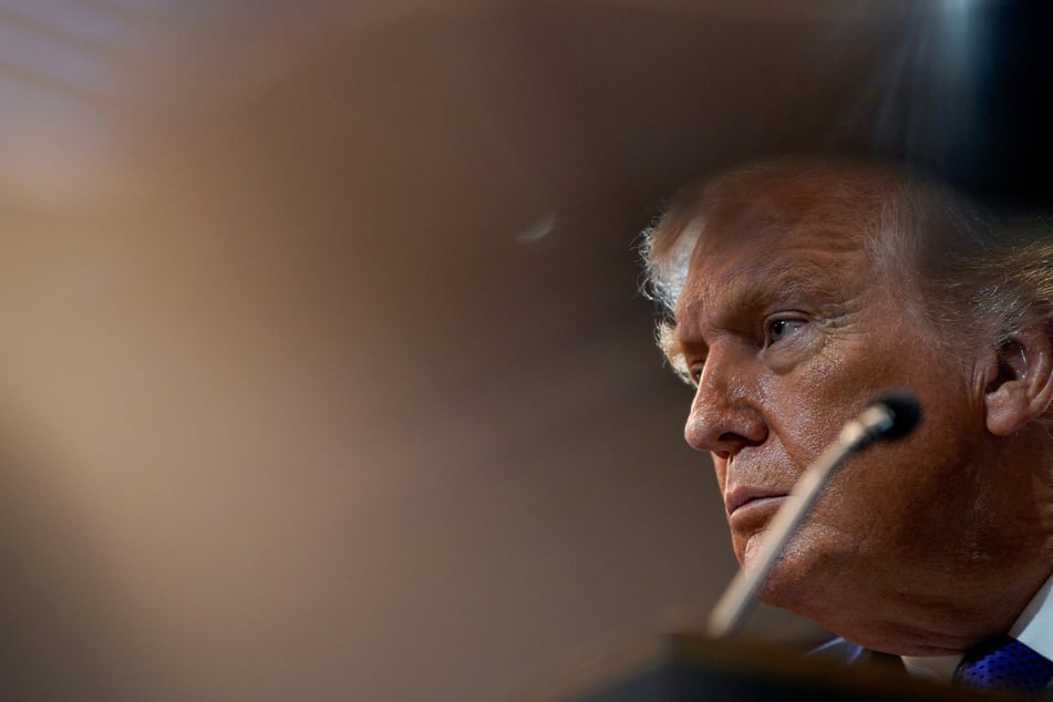 President Donald Trump attends a press briefing at the White House, following the Supreme Court's ruling that he had exceeded his authority when he imposed tariffs, in Washington DC on February 20, 2026.