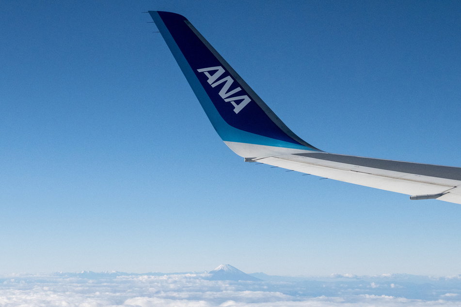 Flight from Tokyo diverted to Seattle after "unruly passenger" tries to open exit doors mid-air