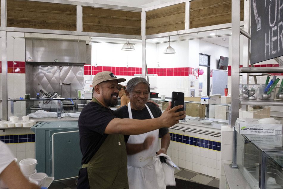 Former Top Chef contestant Sheldon Simeon (l.) is leading efforts to feed the Lahaina community devastated by a catastrophic wildfire last week.