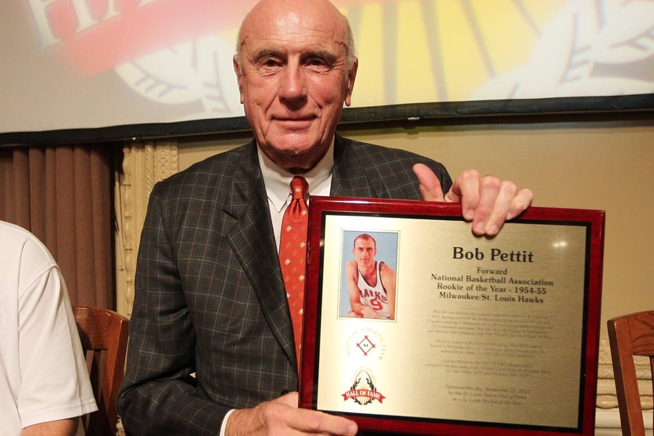 Bob Pettit displays his award during the St. Louis Sports Hall of Fame Rookie of the Year event on September 22, 2011. The NBA legend has passed away at the age of 93.