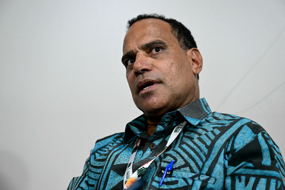 Vanuatu’s Minister for Climate Change Adaptation, Energy, Environment, Meteorology, Geo-Hazards and Disaster Management Ralph Regenvanu speaks during an interview at COP30 in Brazil on November 21, 2025.