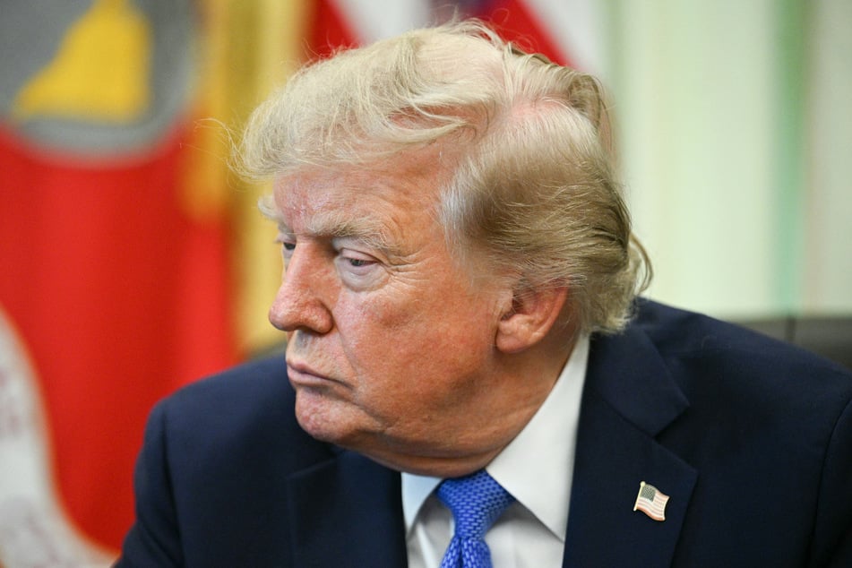 President Donald Trump looks on after signing executive orders in the Oval Office of the White House in Washington, DC, on Thursday.