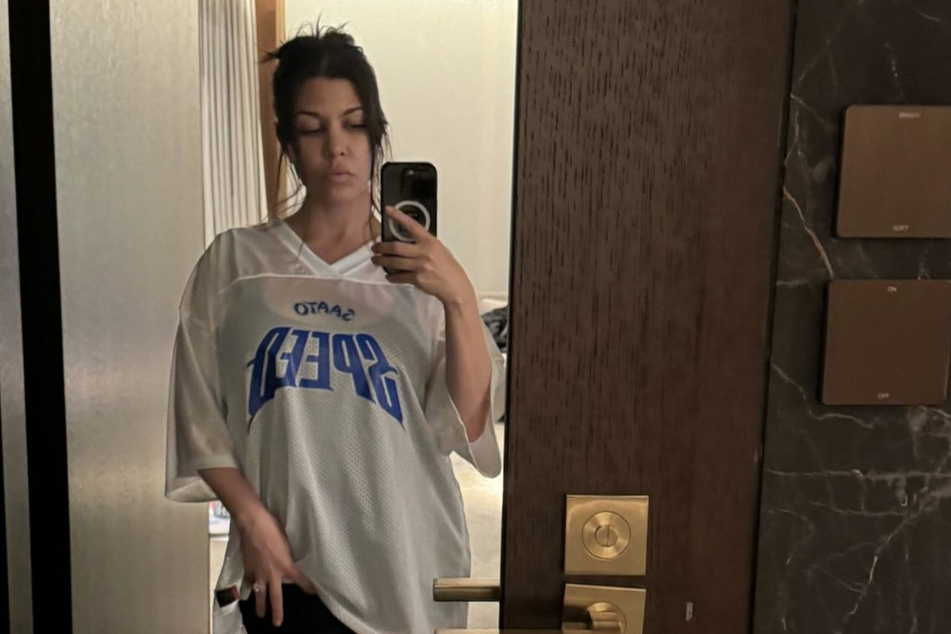 Kourtney Kardashian said she pulled together this chic ensemble thanks to her hubby.
