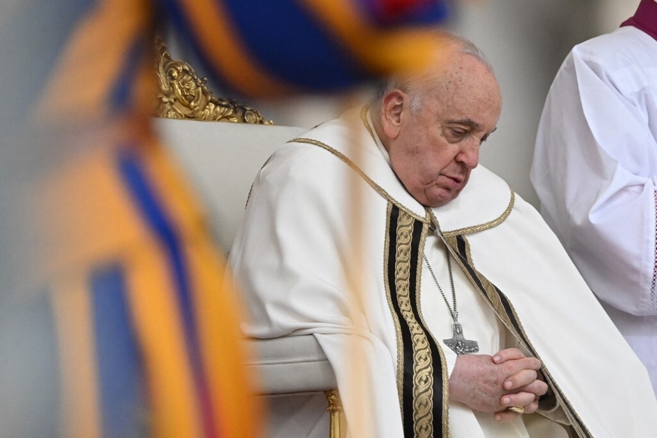 Pope Francis presides over the Easter Mass as part of the Holy Week celebrations, at St Peter's Square in the Vatican on March 31, 2024.
