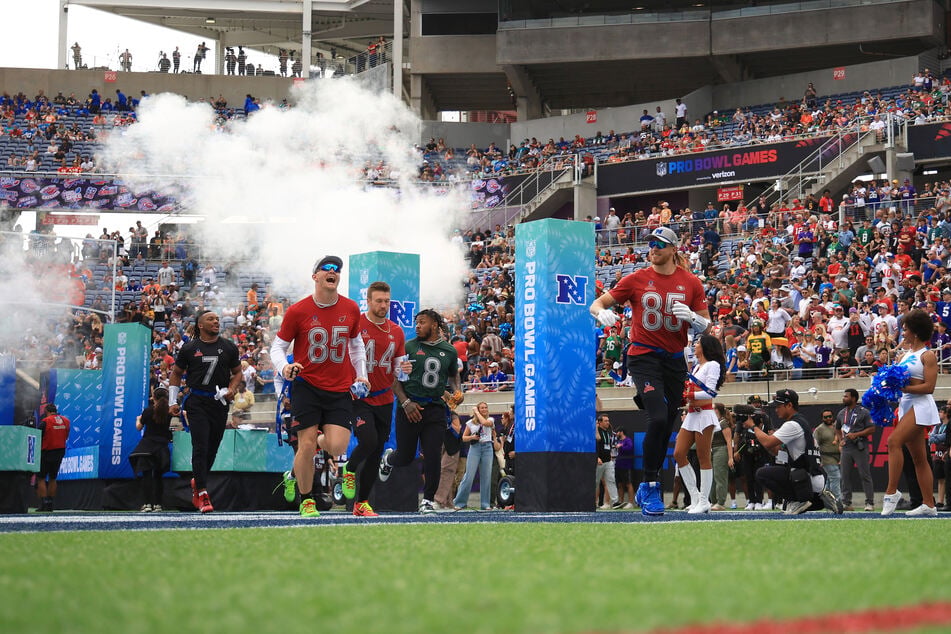 Bijan Robinson of the Atlanta Falcons, Trey McBride of the Arizona Cardinals, Kyle Juszczyk of the San Francisco 49ers, Josh Jacobs of the Green Bay Packers, and George Kittle of the San Francisco 49ers walk onto the field prior to the NFL Pro Bowl Games at Camping World Stadium on February 2, 2025.