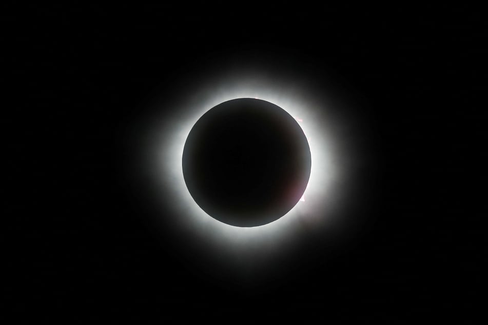 Ayoka said Monday's total solar eclipse was "the epitome of spiritual warfare" and urged followers to "pick a side."