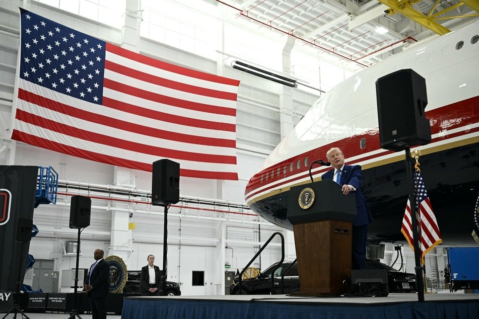 President Donald Trump speaks in front of the new Air Force One, gifted to him by Qatar, in a hangar at Joint Base Andrews in Maryland on Friday.