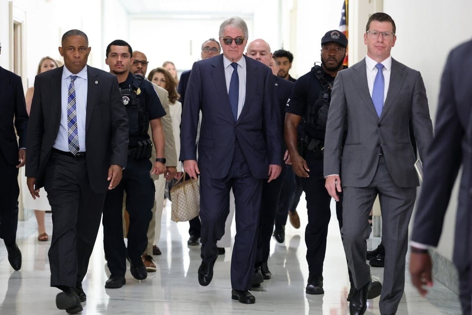 Former CEO of Apollo Global Management Leon Black (c.) arrives to testify at a closed-door interview with the House Oversight Committee on Friday.