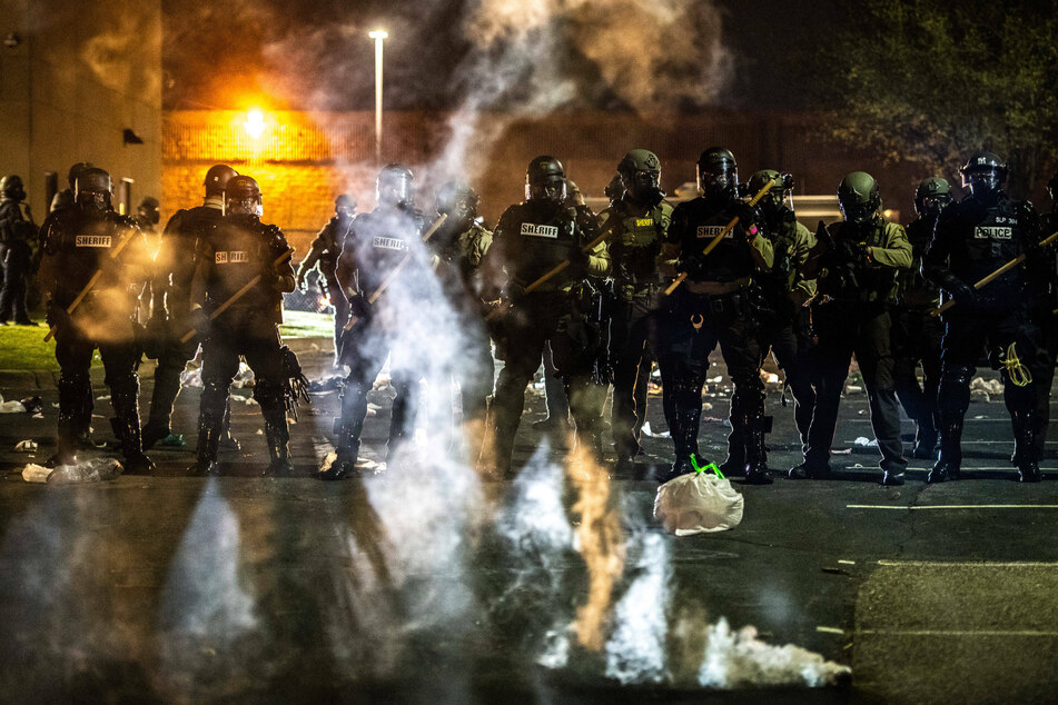 Police and protesters clash after officer fatally shoots Black man outside Minneapolis