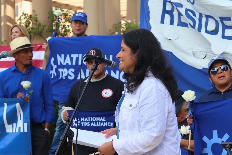Immigrants' rights activist Doris Reina Landaverde speaks at a rally in support of Temporary Protected Status.