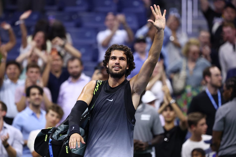 Carlos Alcaraz waves to the crowd after his US Open defeat to Ben Shelton on September 9, 2026. The Spanish tennis sensation has since called for an end to late-night matches at Grand Slams.