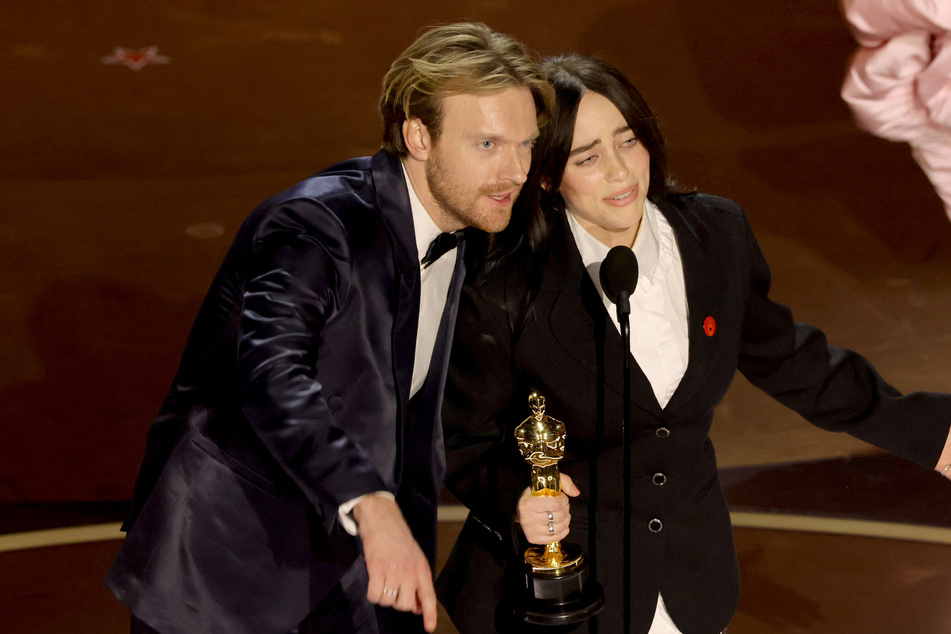 Billie Eilish (r.) and her brother, Finneas O'Connell, also won a Golden Globe and two Grammys for What Was I Made For? from Barbie.