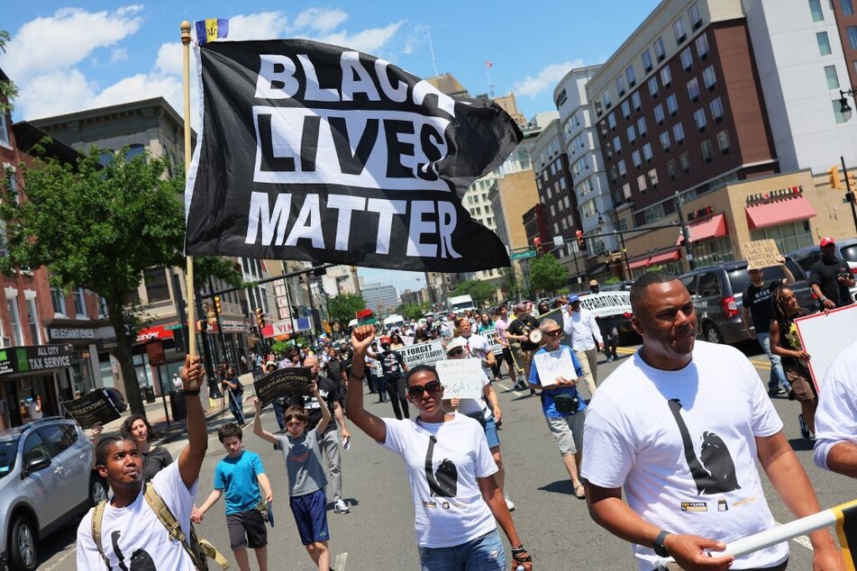 Demonstrators march for reparations during a Juneteenth rally in Newark, New Jersey, on June 17, 2022.