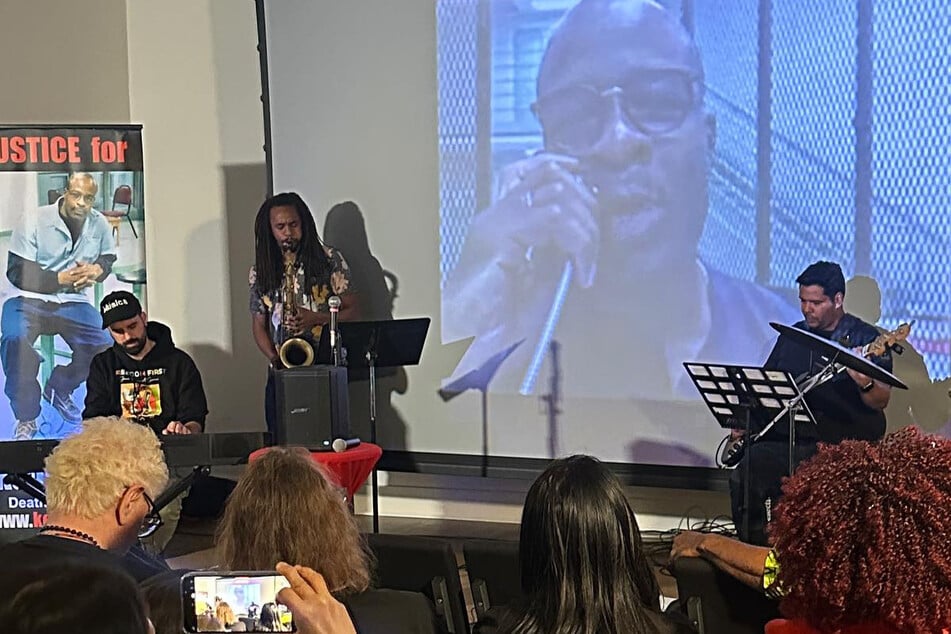 Keith LaMar performs spoken word alongside Albert Marques and fellow musical collaborators.