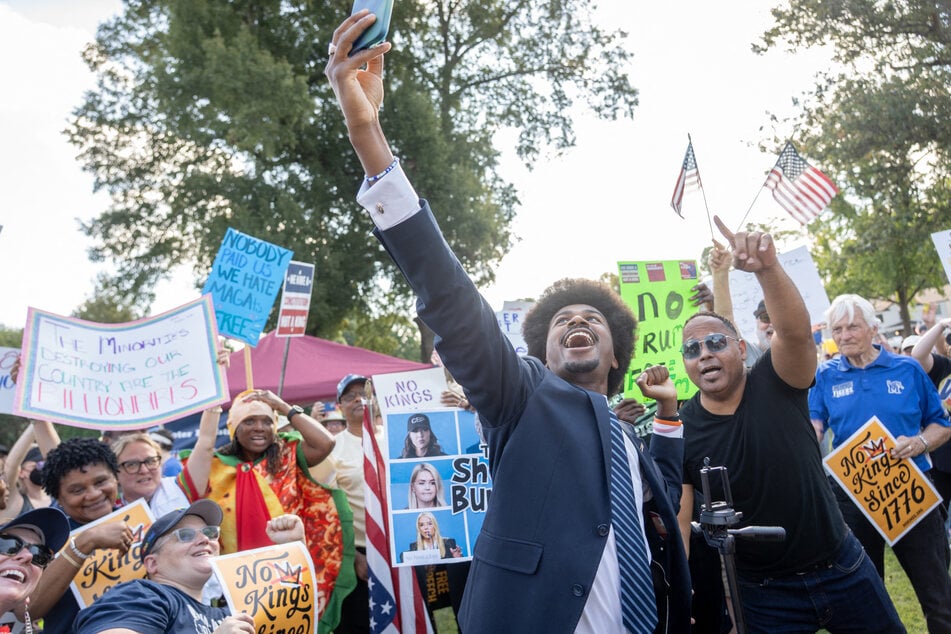 Tennessee State Representative Justin Pearson takes a selfie with protesters at a "No Kings" rally on October 18, 2025.