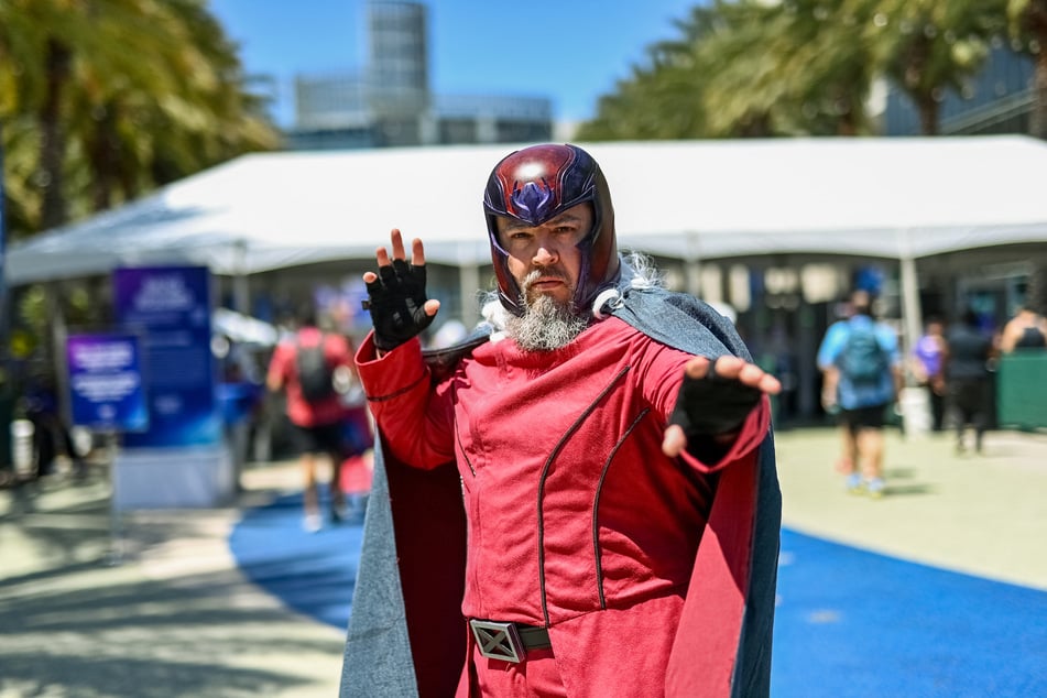 Cosplayers attend D23: The Ultimate Disney Fan Event outside the Anaheim Convention Center in California on August 14, 2026.