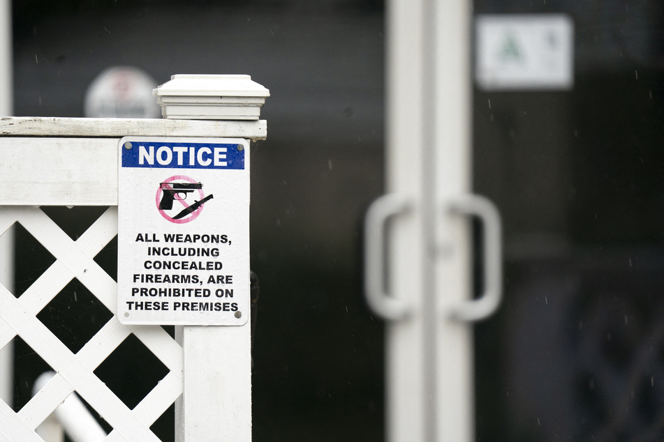 A sign prohibiting firearms is pictured outside Willie's Bar & Grill on St. Helena Island, South Carolina.