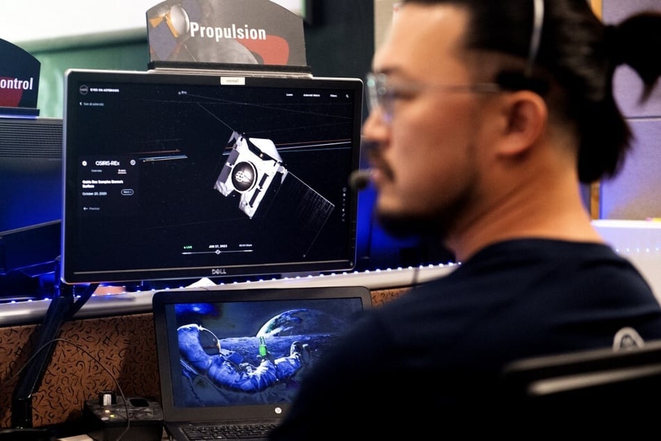 A team member monitor's the capsule operations during NASA's first major asteroid sample recovery rehearsal for its OSIRIS-REx mission.