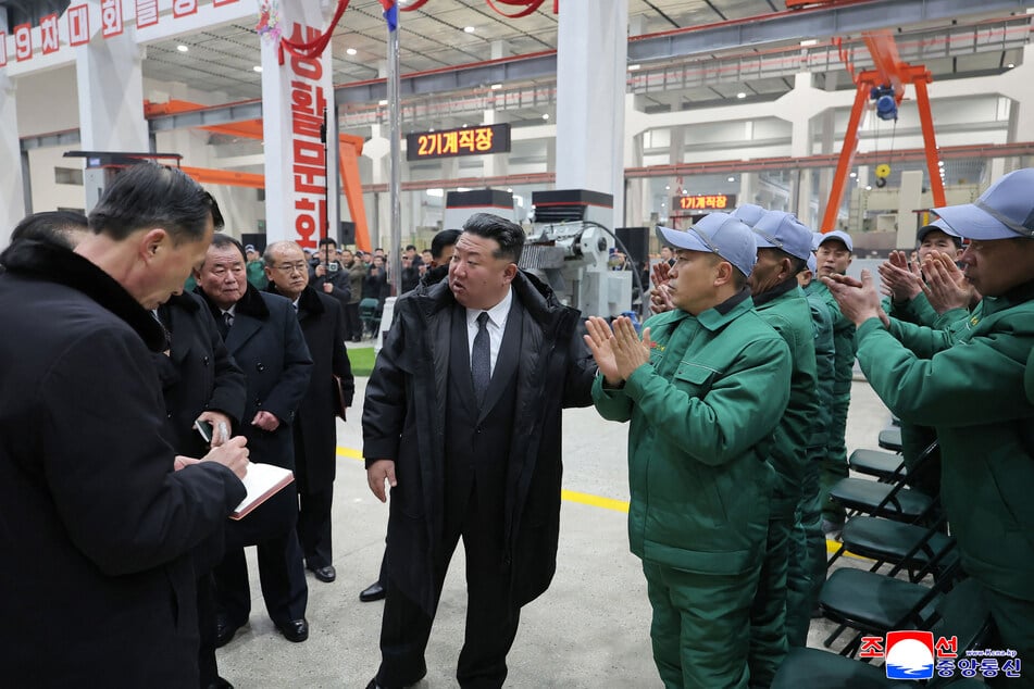 North Korea's leader, Kim Jong-un (c.), publicly lambasted his vice premier in an astonishing attack, firing him "on the spot" according to state media reports.