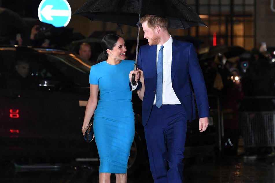On Wednesday, reports confirmed that Prince Harry (r) would be returning to live in the UK with his wife, Meghan, and their two children.
