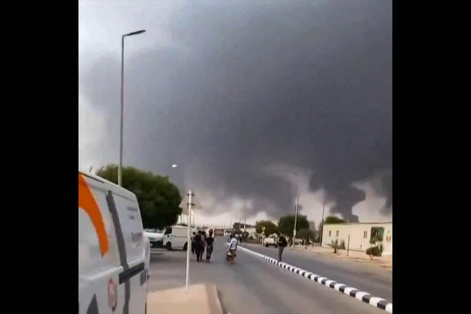 Clouds of smoke rise after strikes, claimed by Yemen's Houthis, on the Saudi Aramco refinery in Jizan.