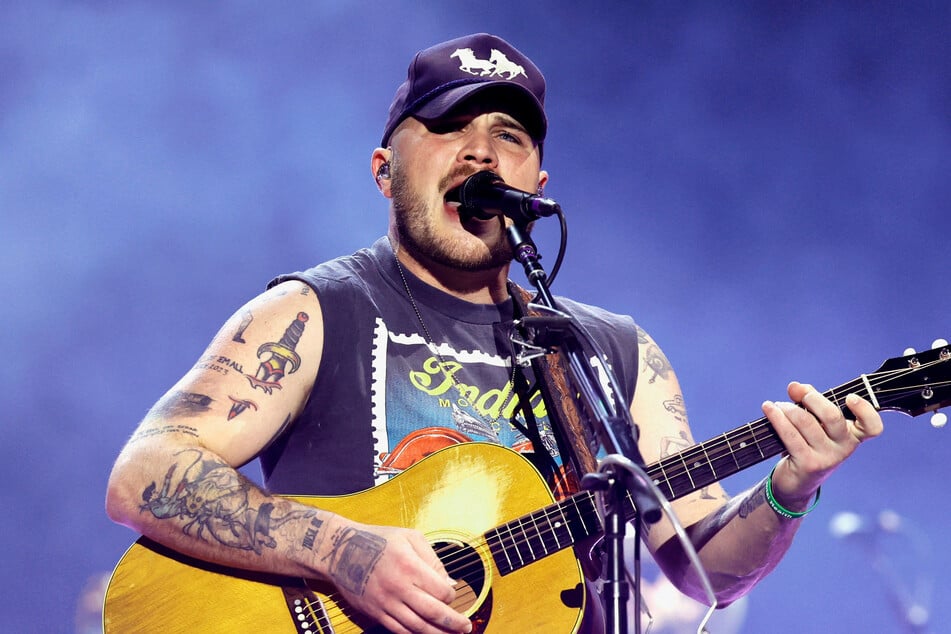 Zach Bryan performs at the T-Mobile Mane Stage during the 2025 Stagecoach Festival on April 25 in Indio, California. The country singer wore a "Free Palestine" shirt as he performed at Gillette Stadium on Friday.
