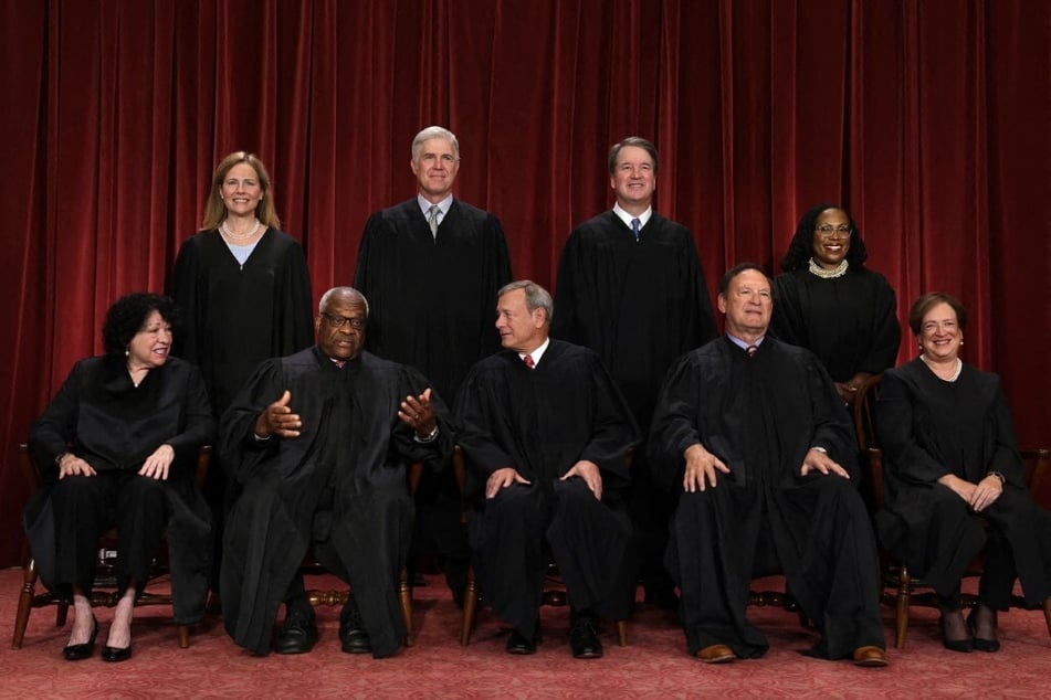Members of the Supreme Court pose for their official portrait at the East Conference Room of the Supreme Court building on October 7, 2022.